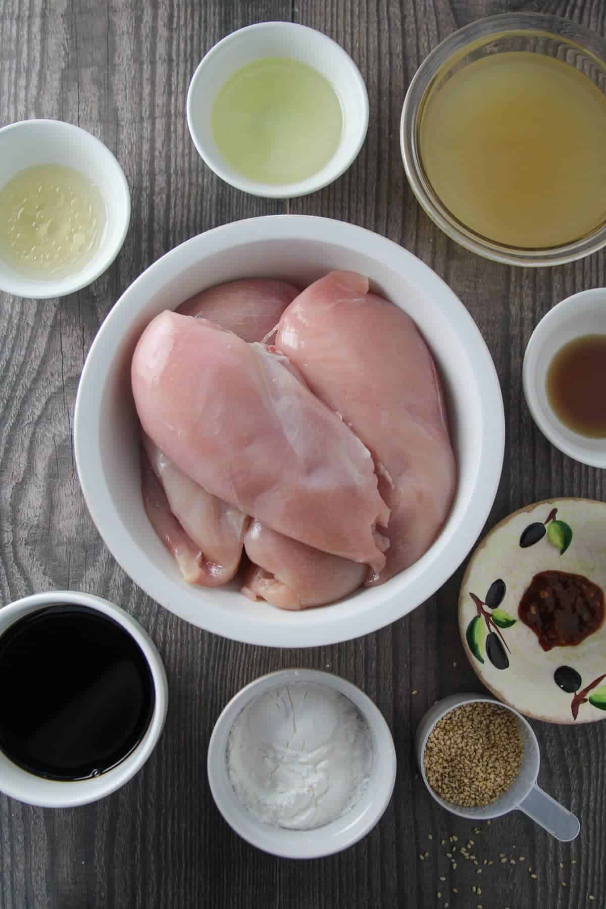chicken breast, rice vinegar, sesame oil, brown sguar, chili garlic paste, soy sauce in individual bowls