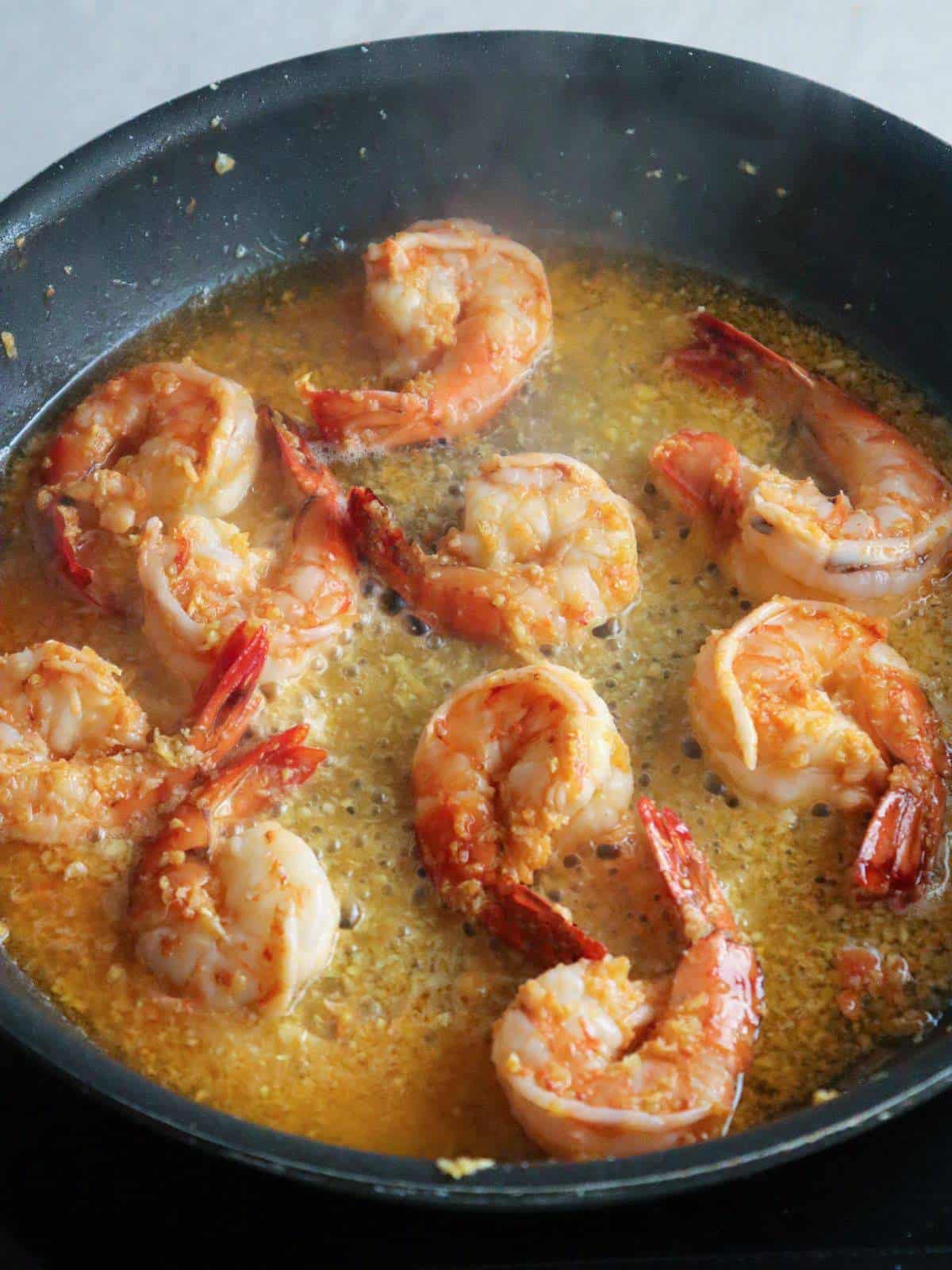 cooking shrimp in a pan