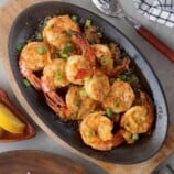 shrimp scampi with Sriracha on a sizzling skillet