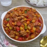 menudong manok in a white serving bowl.