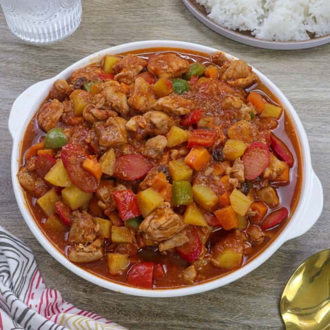 menudong manok in a white serving bowl.