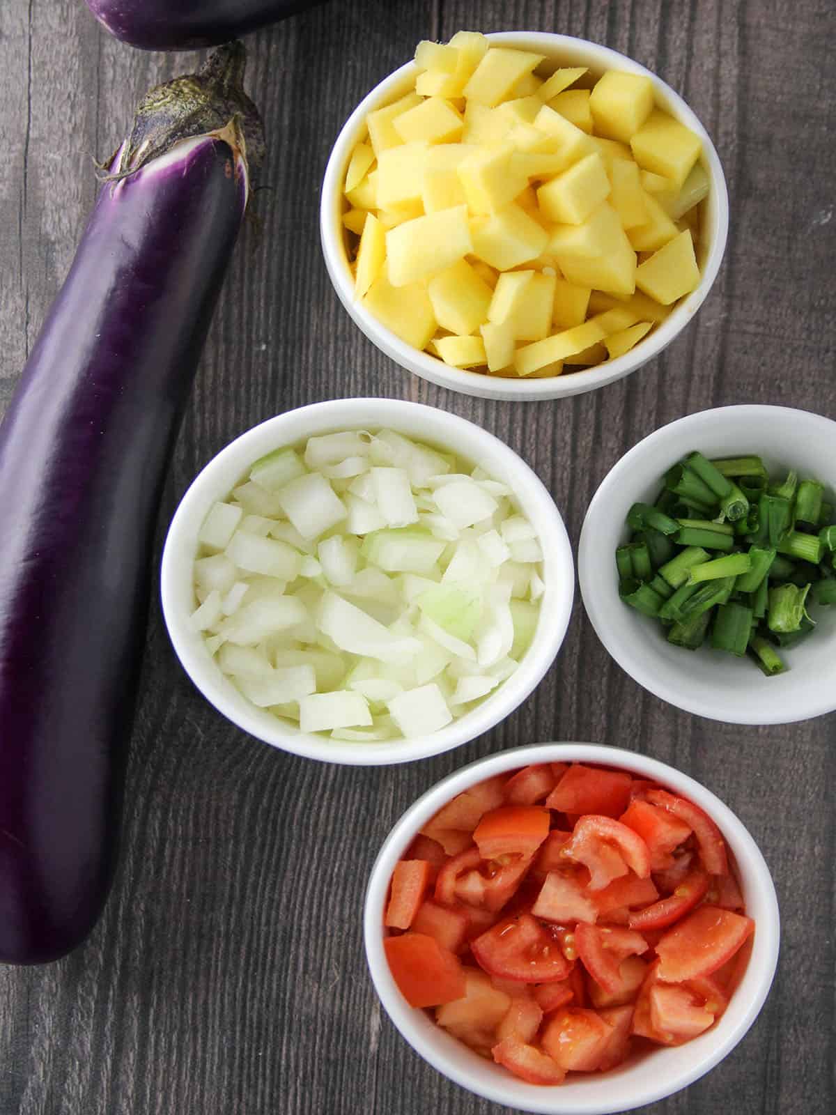 eggplant, mangoes, onions, tomatoes, green onions