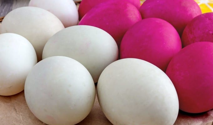 plain and colored salted eggs on a platter