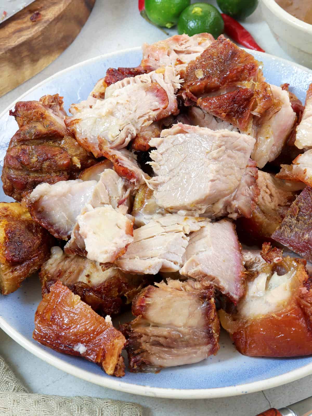 chopped up crispy oven roasted pork shoulder on a serving plate