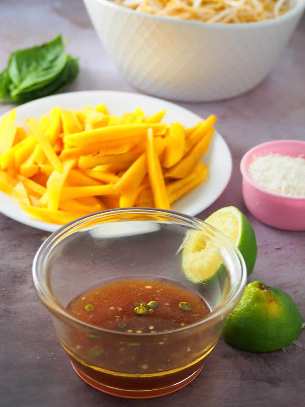 sliced mangoes, chopped peanuts, fresh basil, and lime dressing