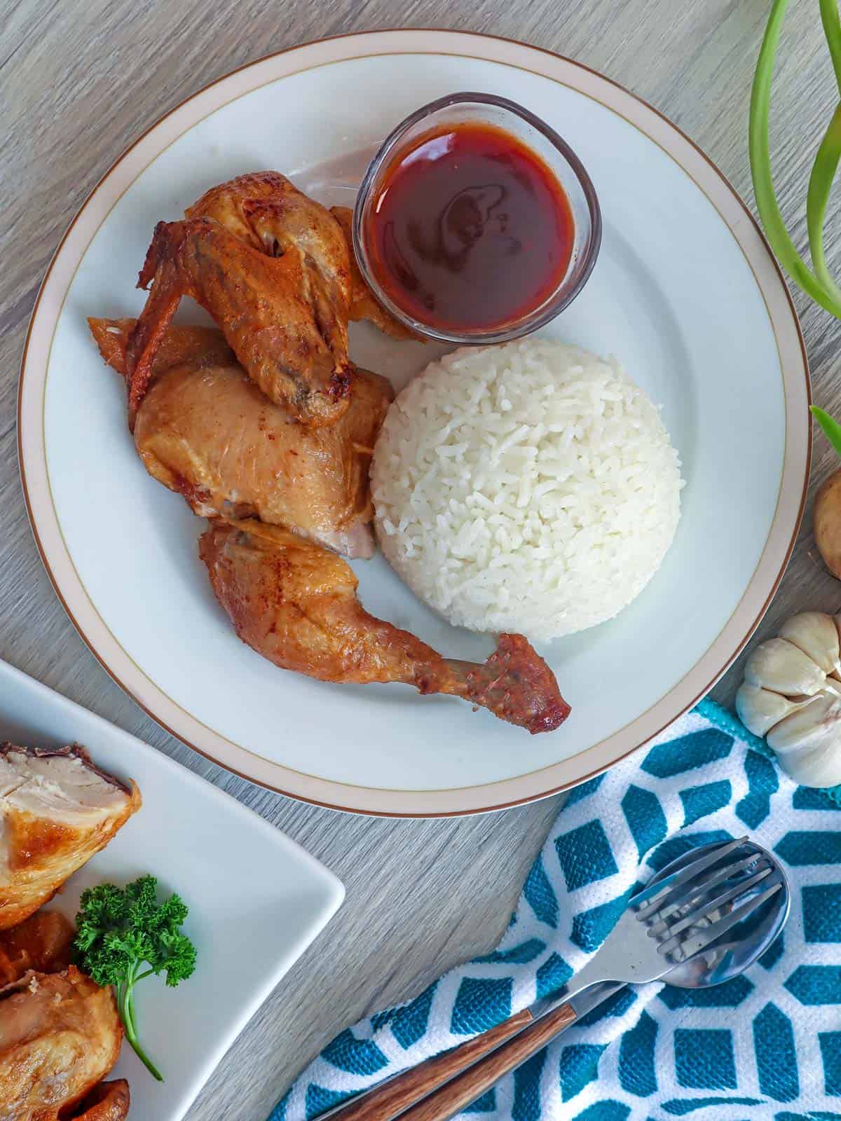 Max's Crispy Fried Chicken on a plate with steamed rice and ketchup