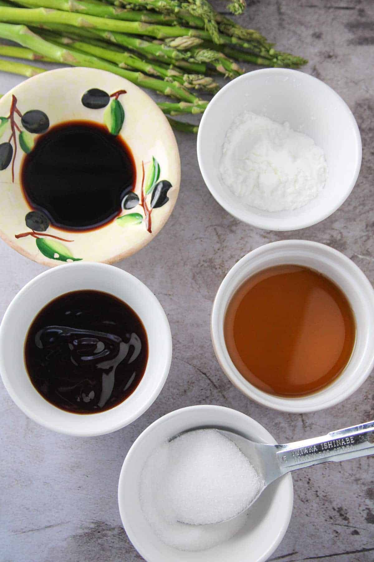 soy sauce, cornstarch, sugar, Chinese cooking wine, oyster sauce in ramekins