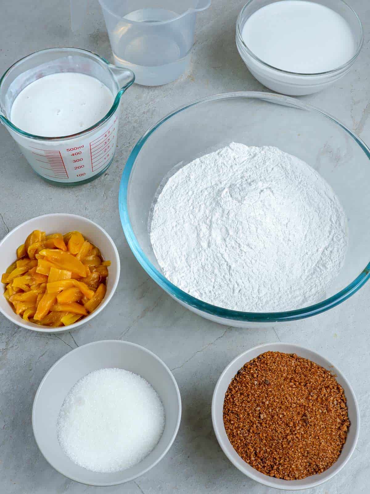 glutinous rice flour, brown sugar, jackfruit, coconut milk, water, sugar, coconut cream in bowls