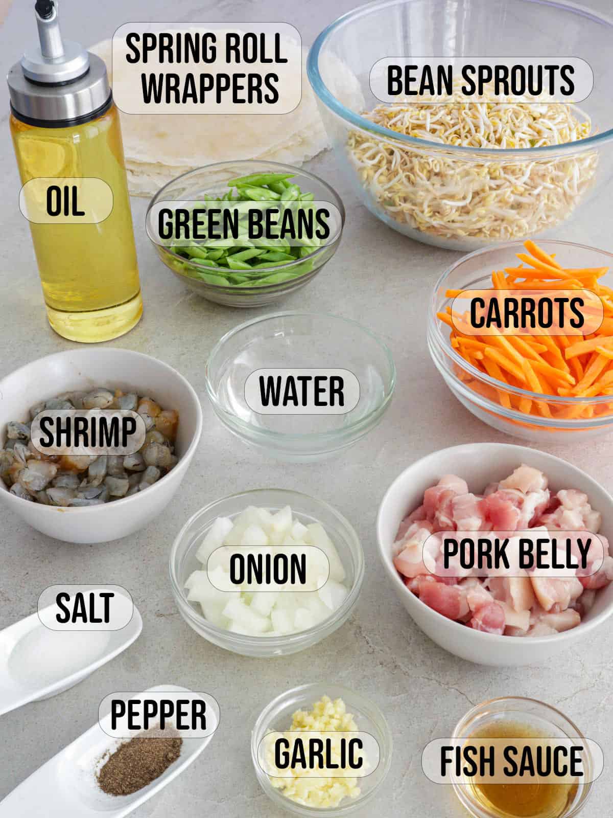 minced shrimp, diced pork, sliced onions, minced garlic, julienned carrots, sliced green beans, bean sprouts, salt, pepper, spring roll wrappers in bowls.
