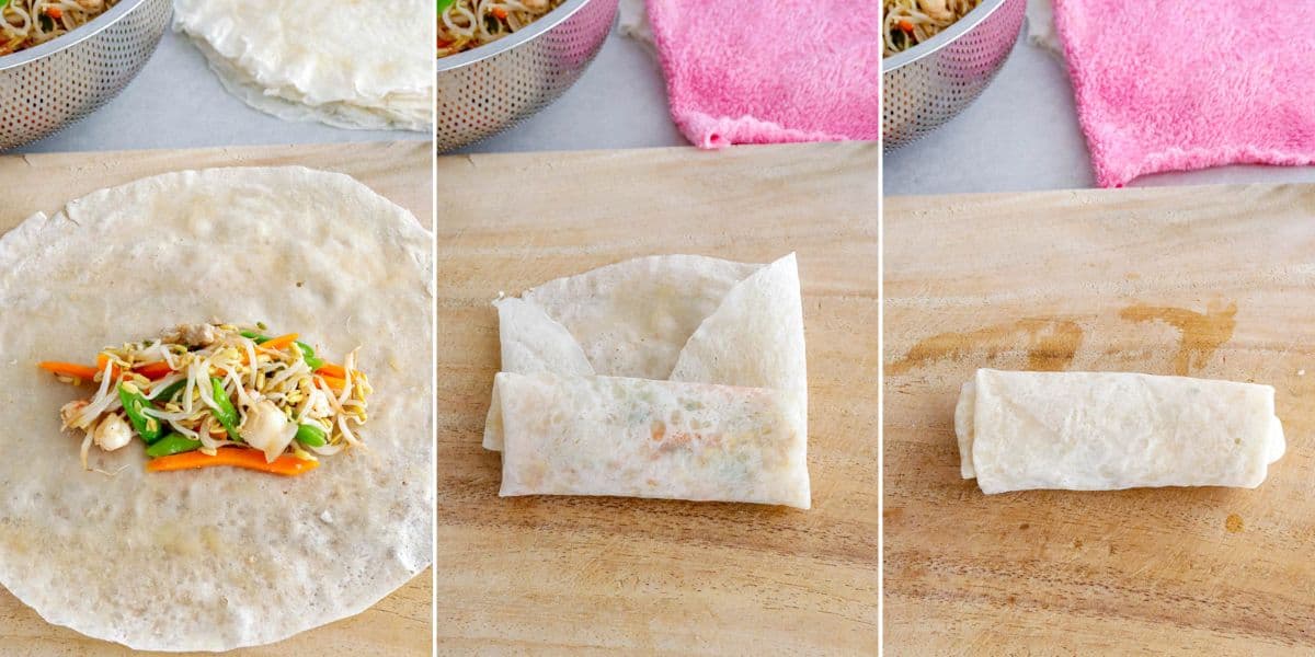 rolling lumpia togue on a wooden cutting board.
