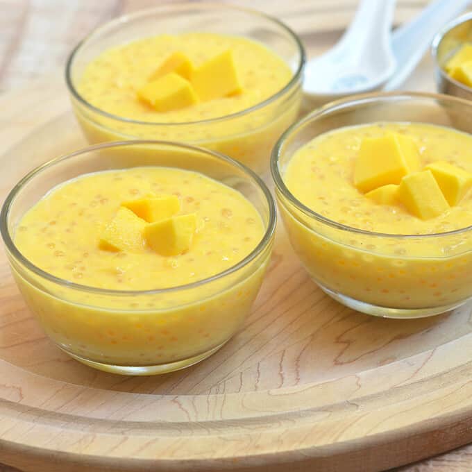 Mango Sago made with mangoes, tapioca pearls, and milk. Sweet, tangy and creamy, it's a summer dessert you'd want all year long!