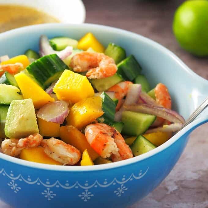 Grilled Shrimp Mango Avocado Salad in a blue serving bowl