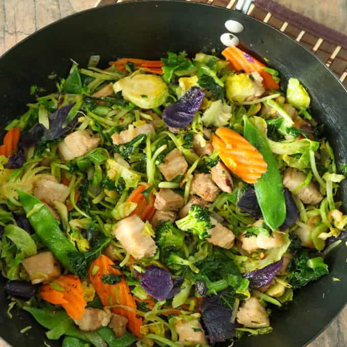 Asian Stir-fry with vegetables and tender pork strips in a wok