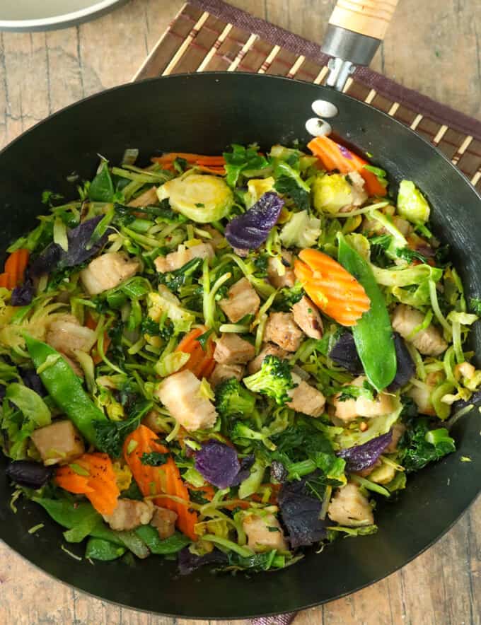 Asian Stir-fry with vegetables and tender pork strips in a wok