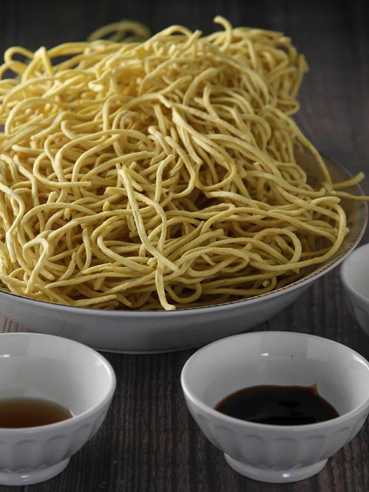 noodles, brown sugar, soy sauce, oyster sauce in individual bowls