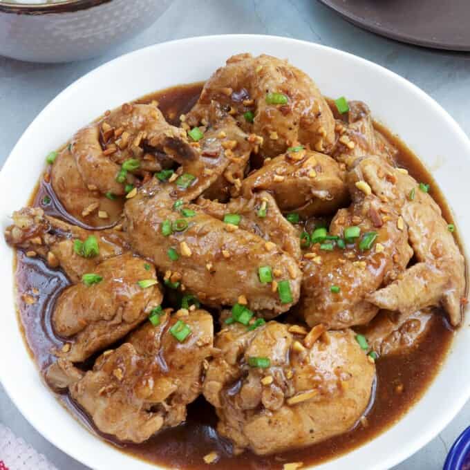 Chicken Adobo with Tamarind in a white serving bowl