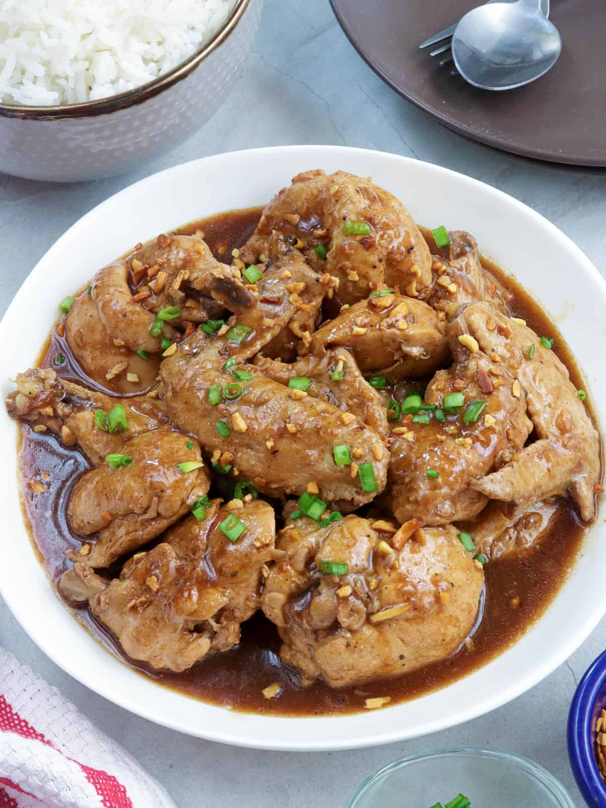 Chicken Adobo with Tamarind in a white serving bowl