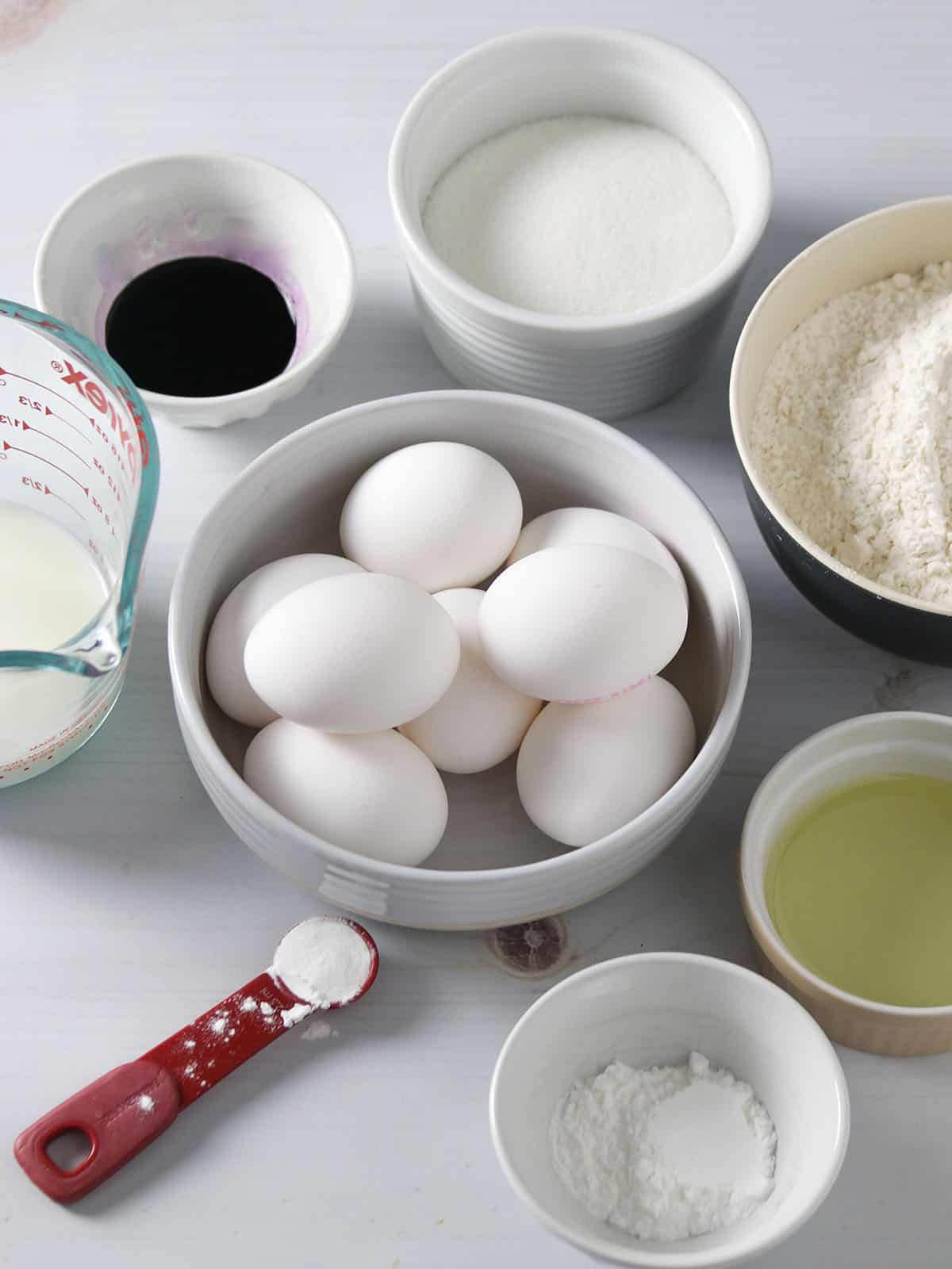 eggs, flour, milk, baking powder, sugar, cream of tartar, extract in bowls