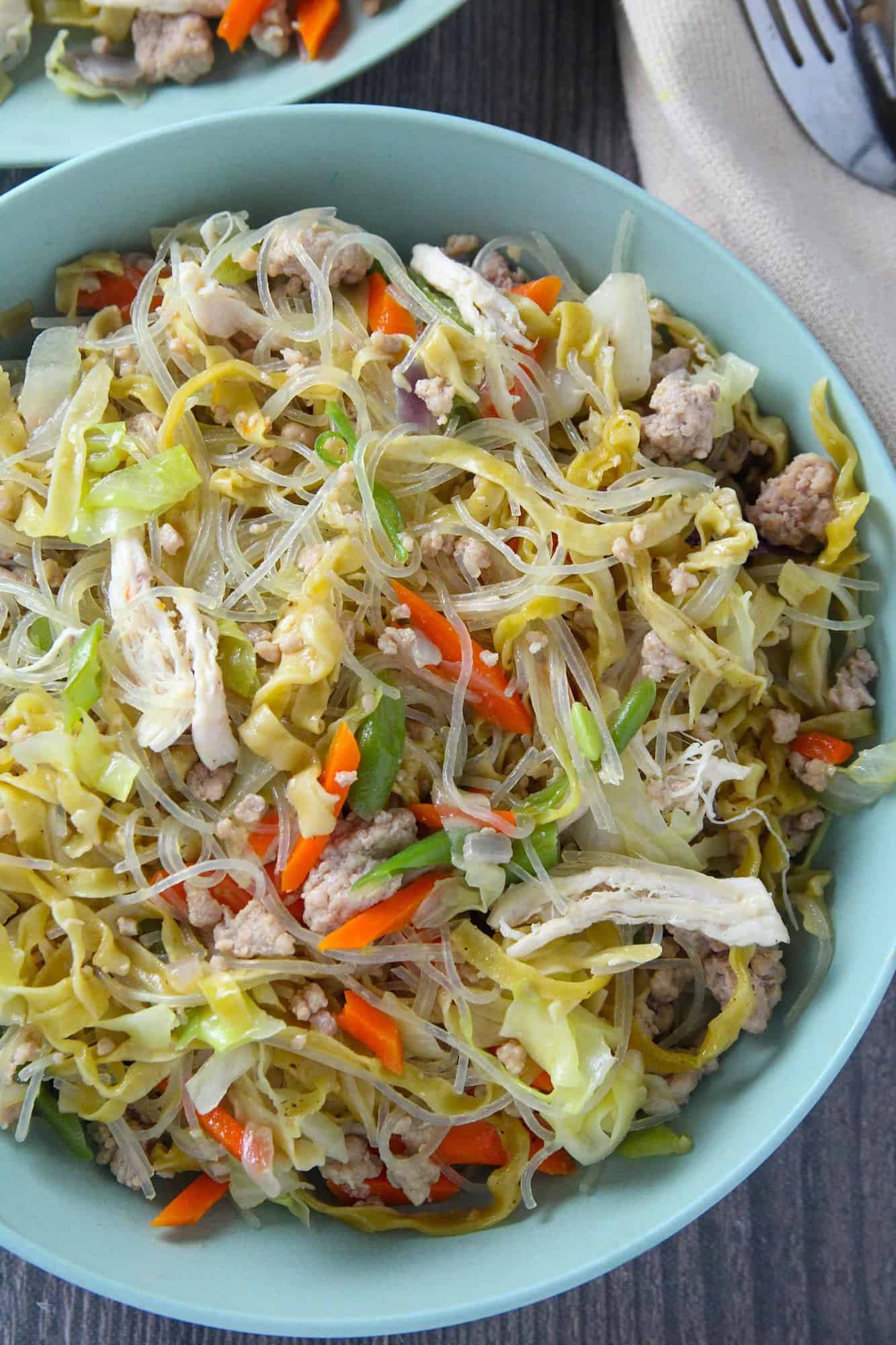 pancit langlang in a blue serving bowl