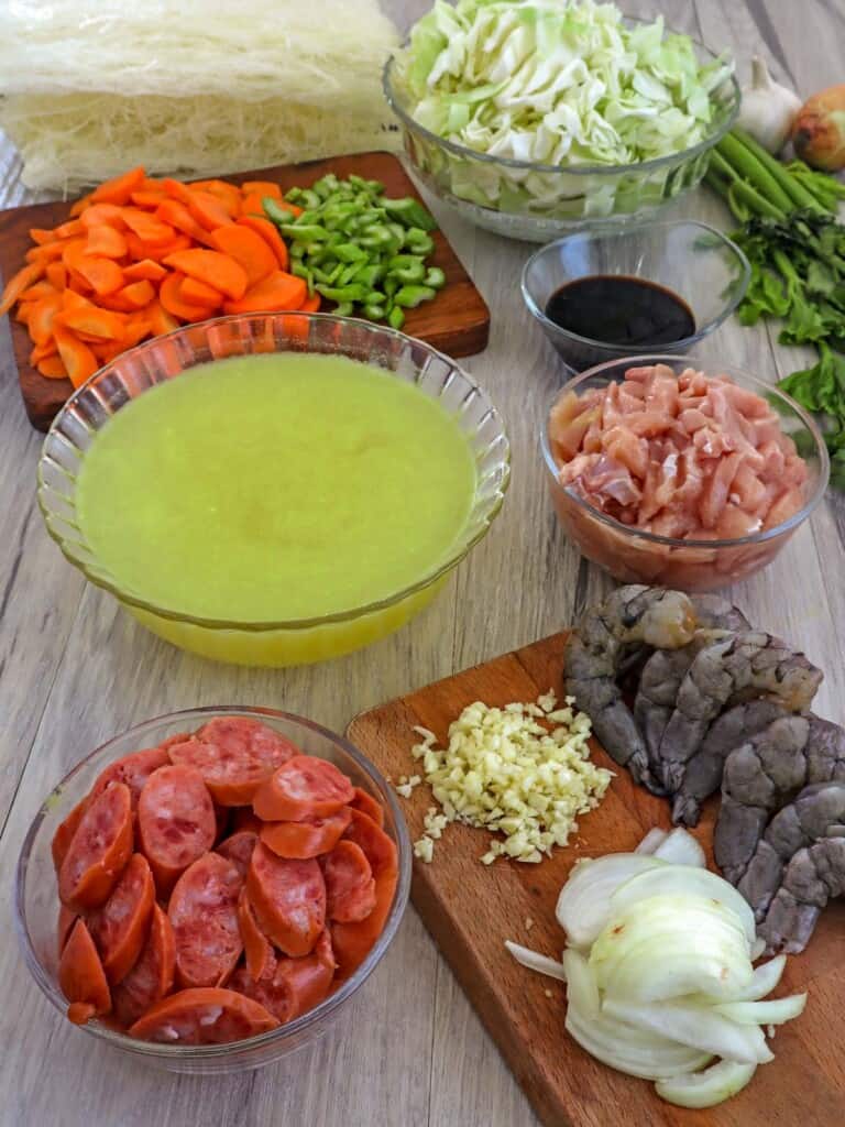 chicken, hamonado sausage, shrimp, cabbage, carrots, celery, onions, garlic, and chicken broth