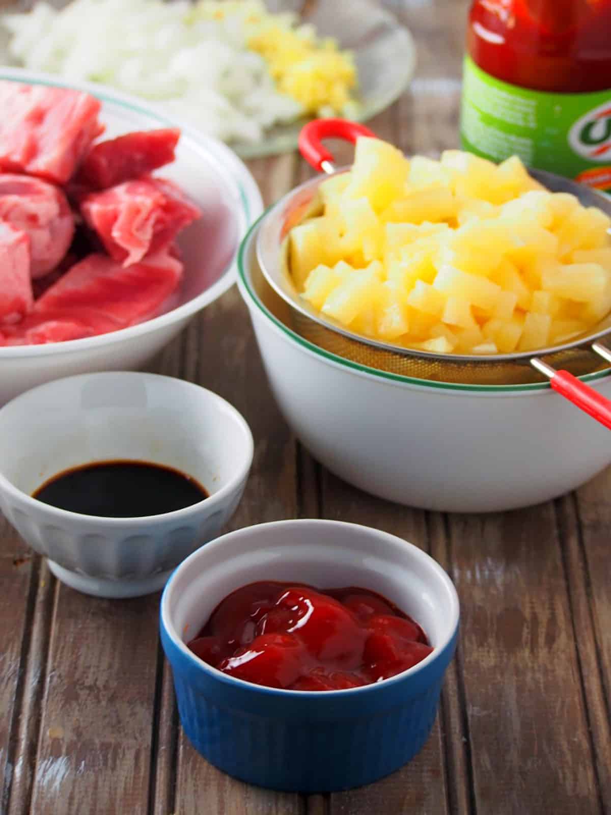 spare ribs, ketchup, soy sauce, and pineapples