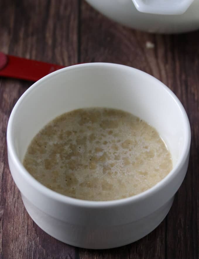 proofing yeast in a white bowl