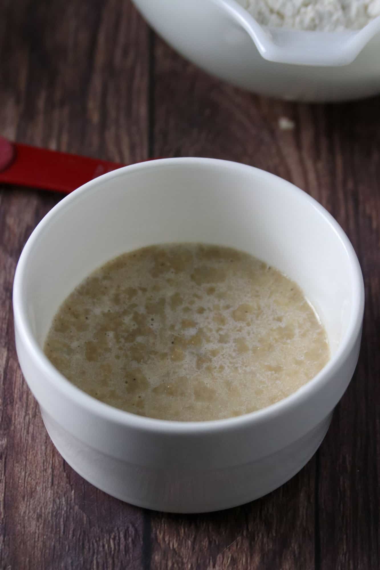 proofing yeast in a white bowl