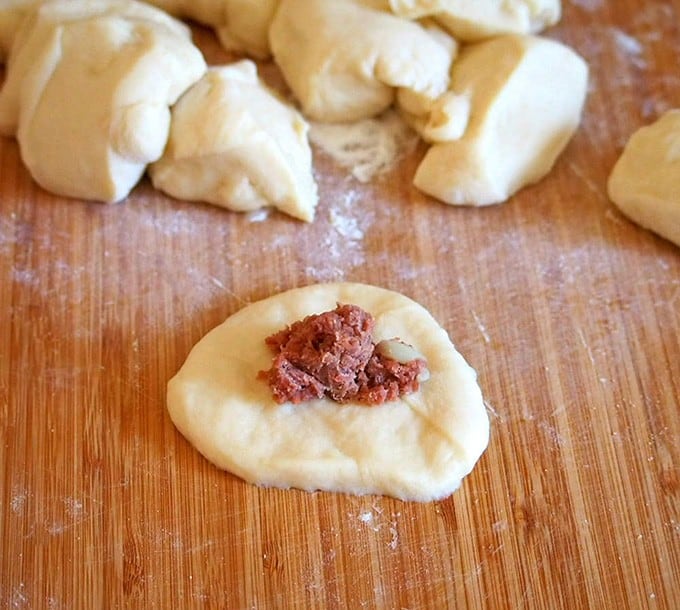 stuffing pandesal dough with corned beef filling