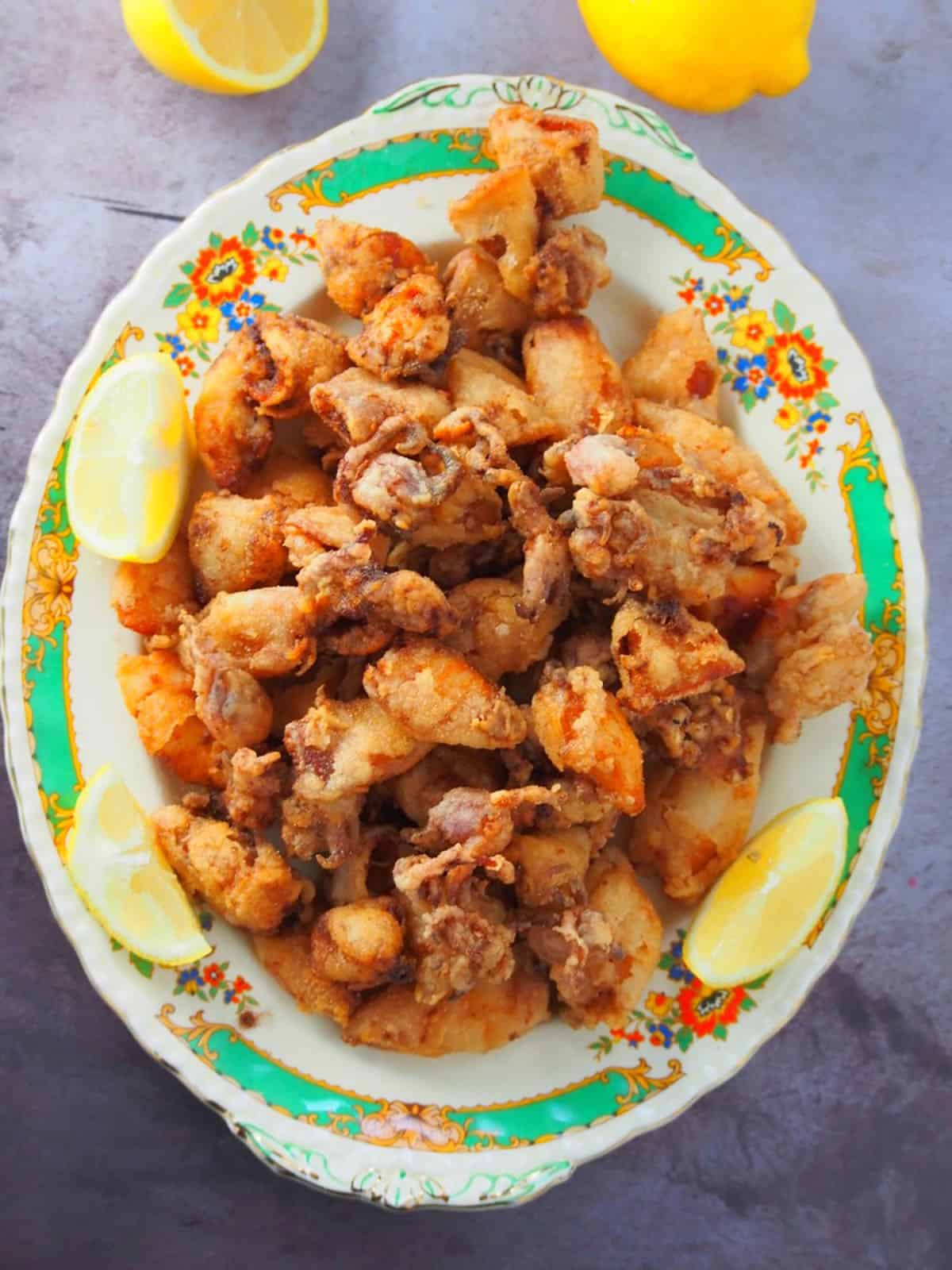 top view of crispy fried calamares on a serving platter