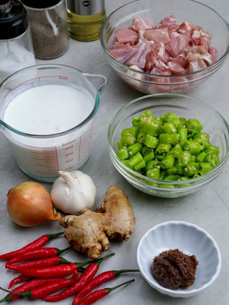 diced chicken thighs, ginger, garlic, onion, chopped finger chilies, Thai chili peppers, shrimp paste, coconut milk
