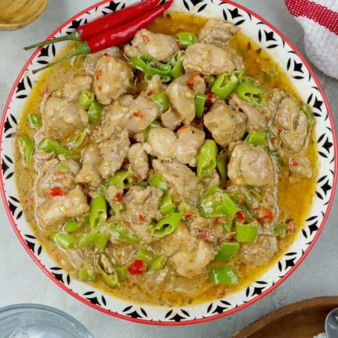 spicy chicken stew with coconut milk in a serving dish