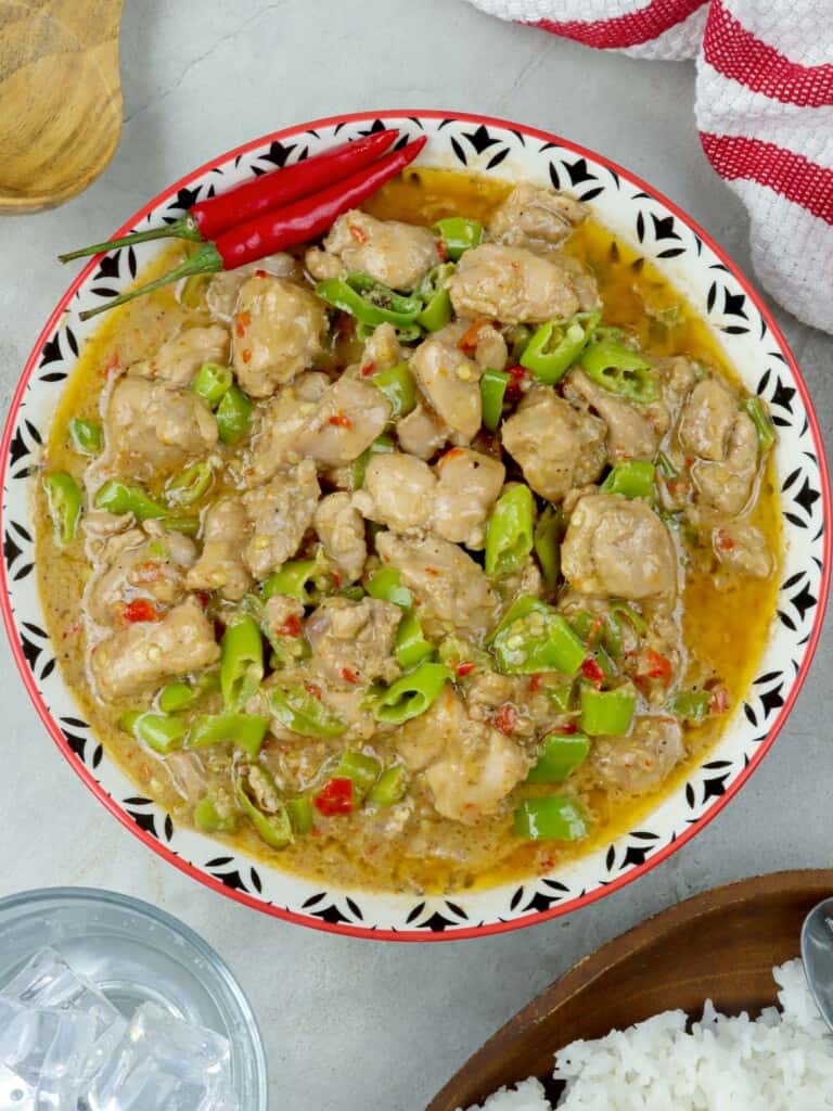 spicy chicken stew with coconut milk in a serving dish