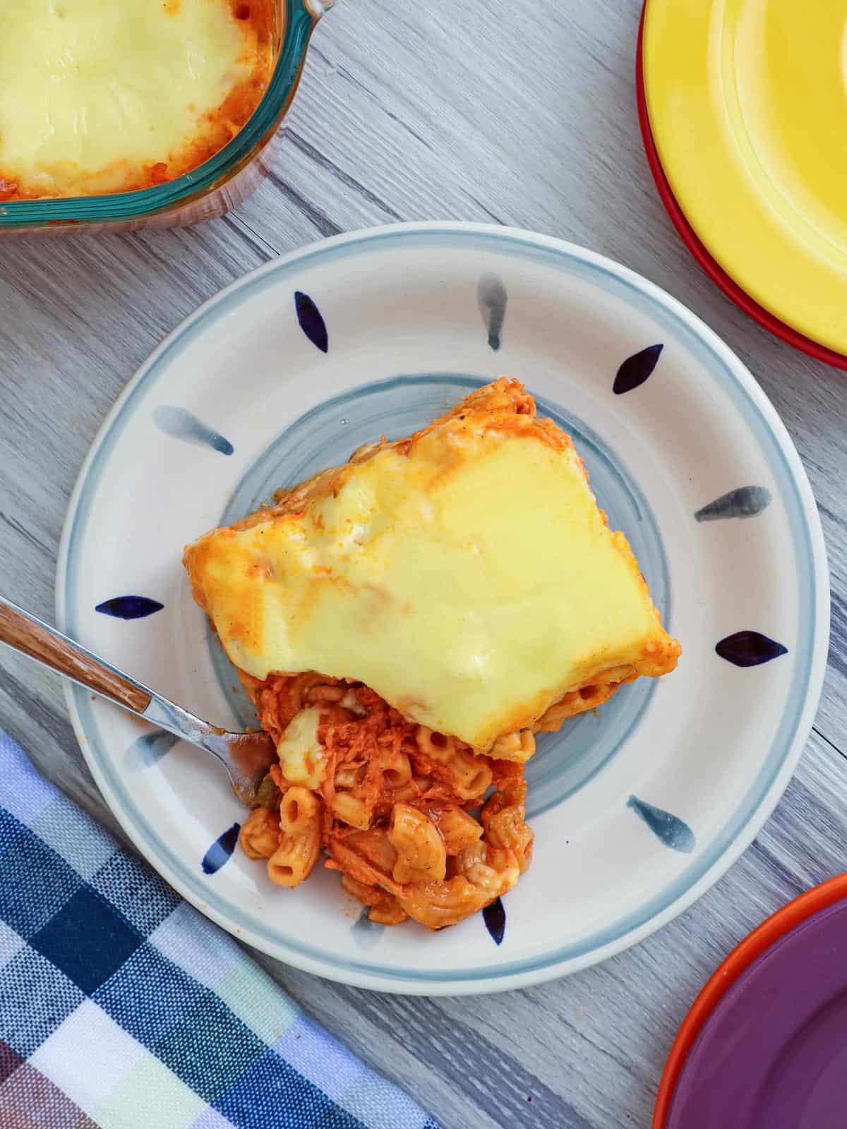 baked macaroni with chicken on a serving plate