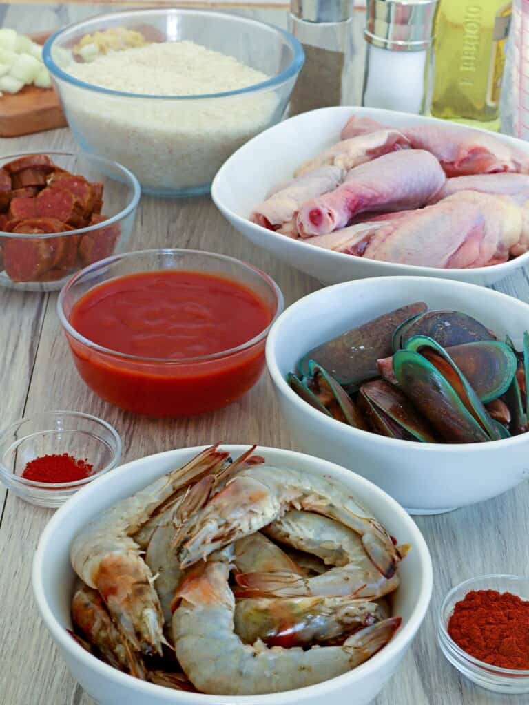 shrimp, rice, tomato sauce, mussels, chicken, sausage, paprika, saffron