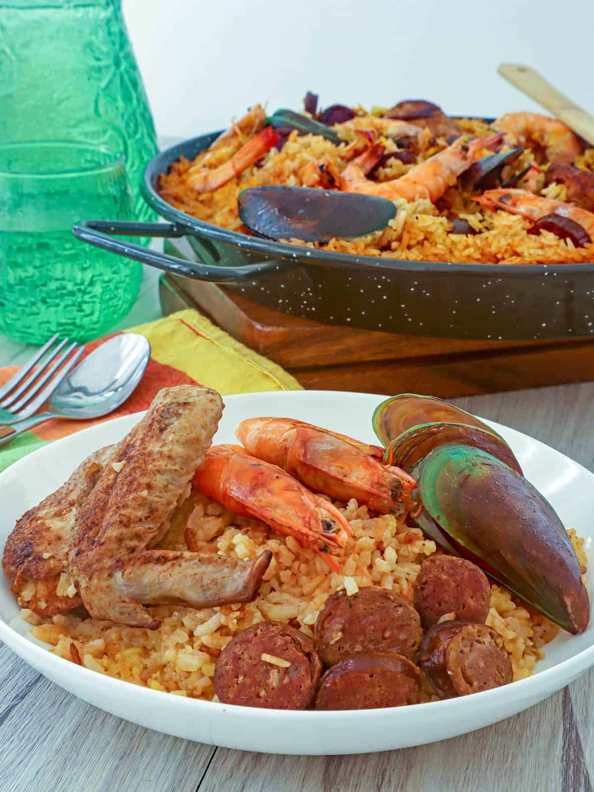 Mixed paella in a white serving bowl