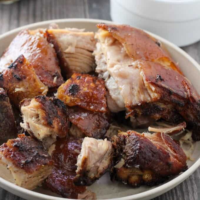 chopped crispy lechon in a white bowl