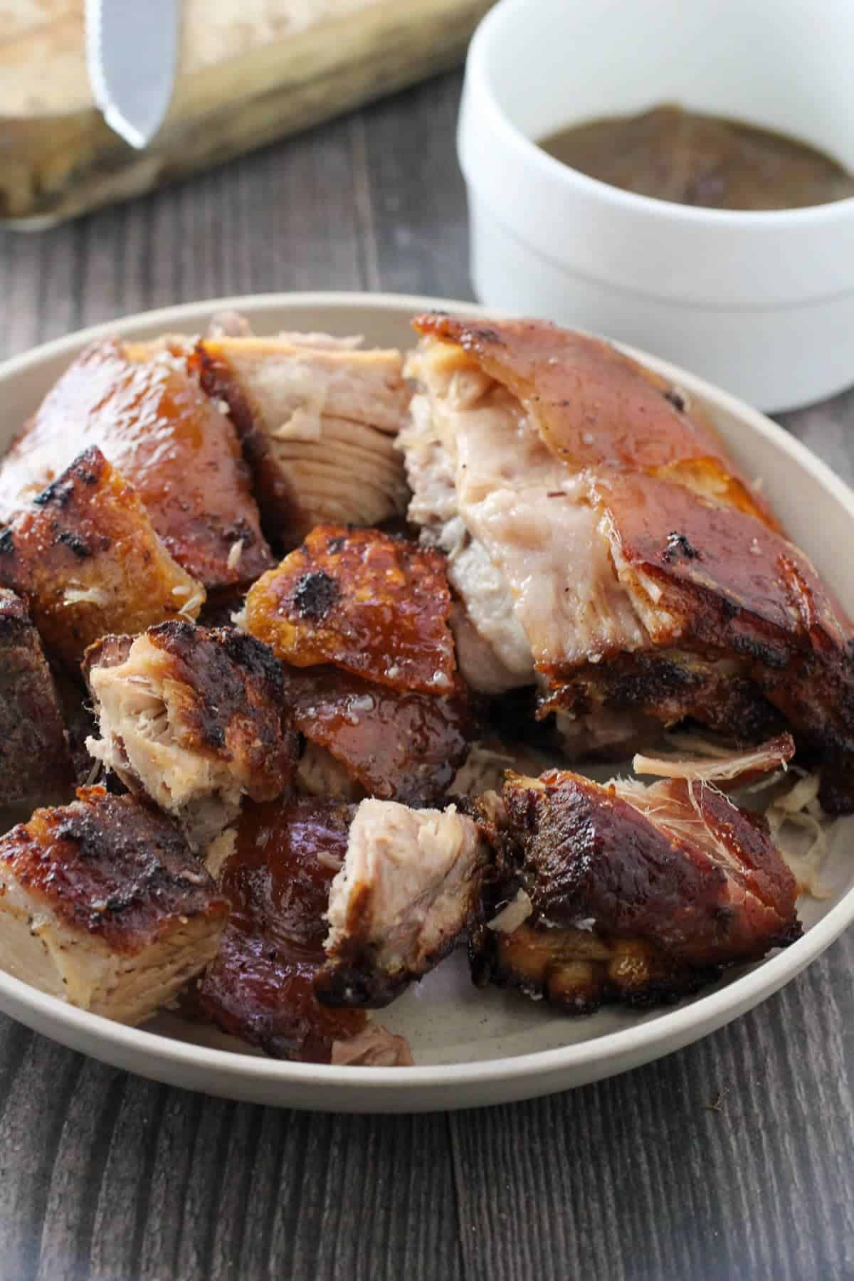 chopped crispy lechon in a white bowl