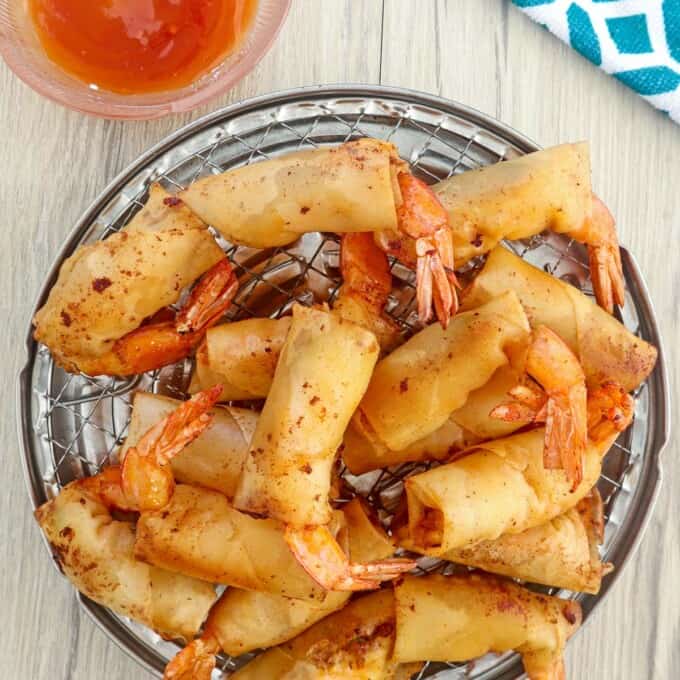 Rellenong Hipon on a serving platter with a side of sweet chili sauce