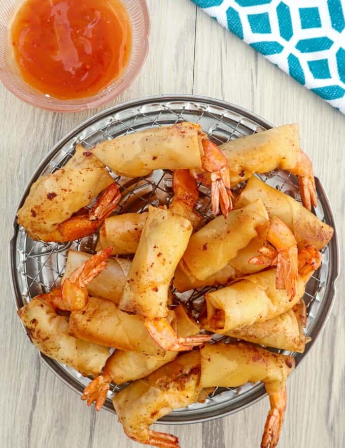 Rellenong Hipon on a serving platter with a side of sweet chili sauce