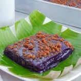 slice of ube kalamay with latik topping on a serving plate