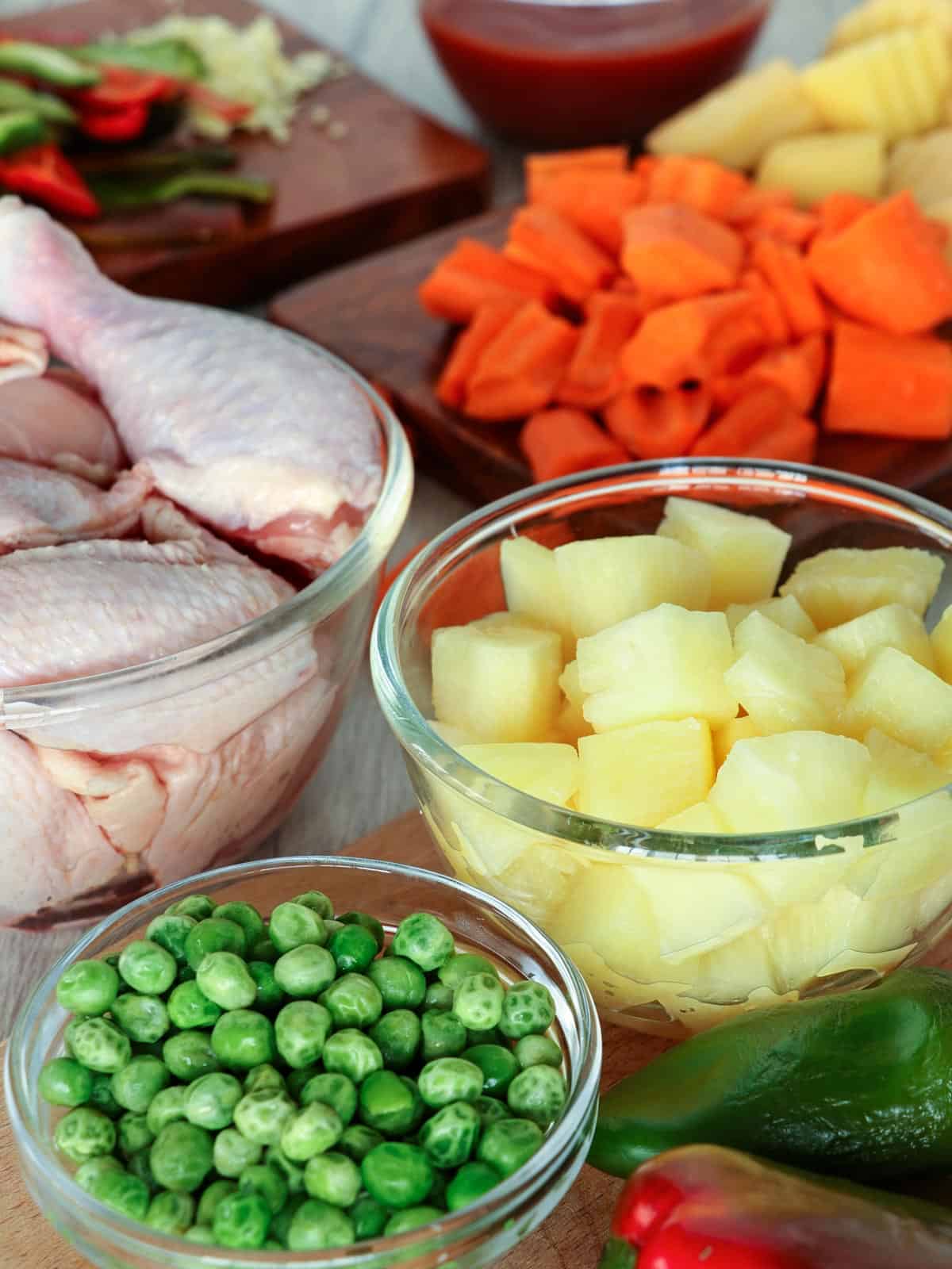 cut-up chicken, green peas, carrots, pineapple cubes, bell peppers, potatoes