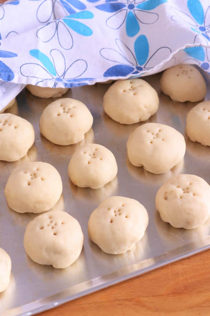 Proofing coconut-filled dough for pan de coco