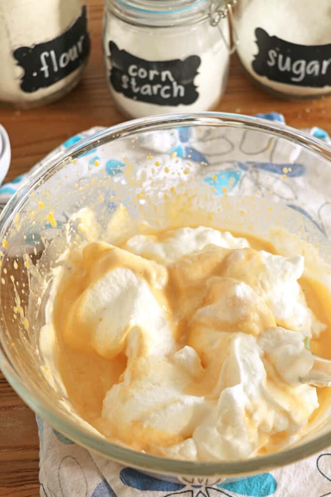 folding the meringue into the yolk batter