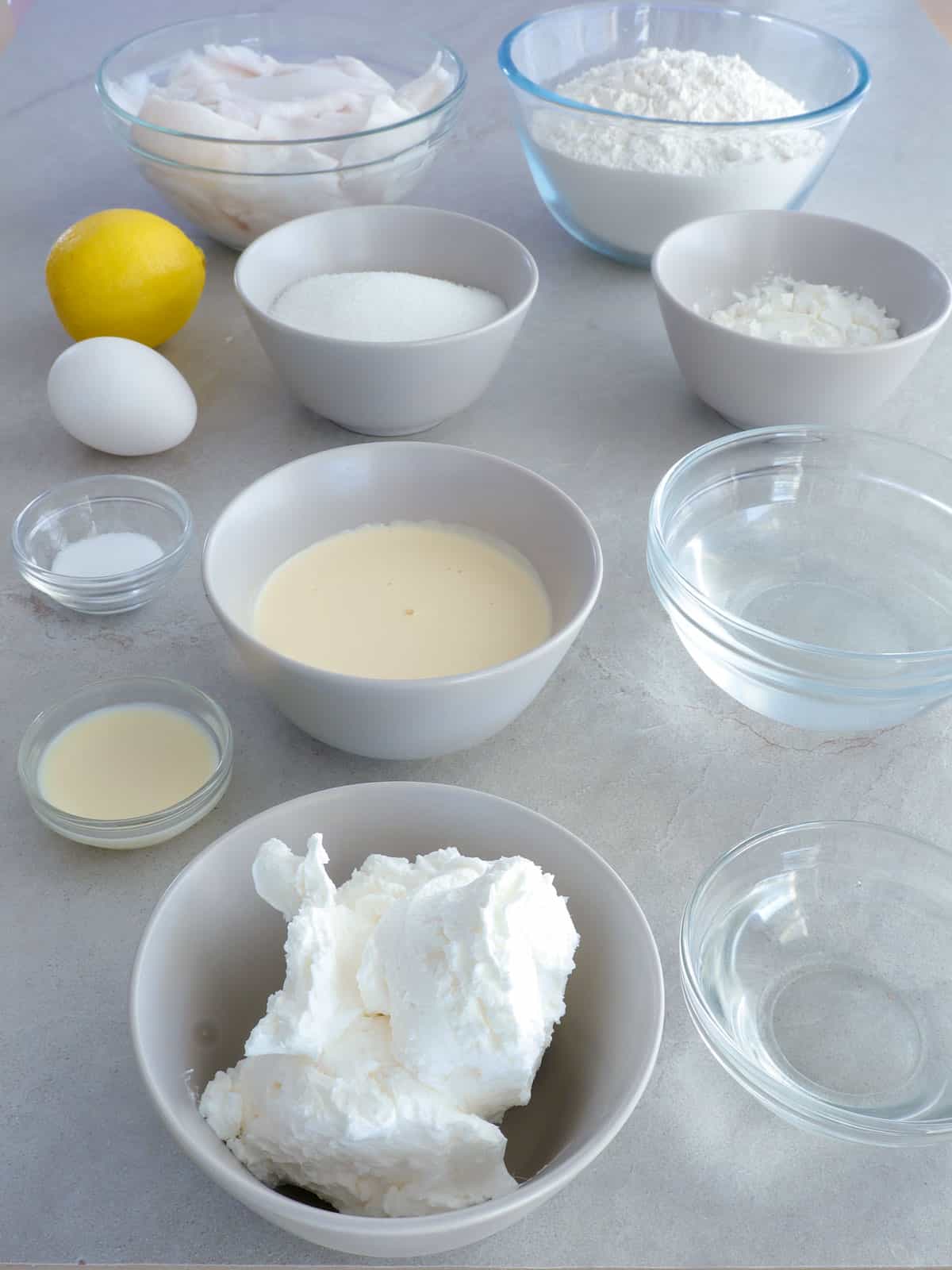 young coconut meat, flour, lard, water, vinegar, sugar, egg, lemon, cornstarch, coconut water, milk, all-purpose cream in bowls