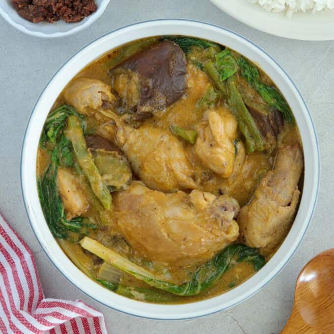 Chicken Kare-Kare in a white serving bowl.