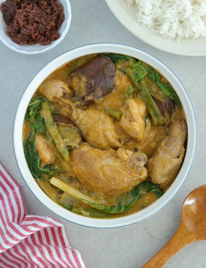 Chicken Kare-Kare in a white serving bowl.