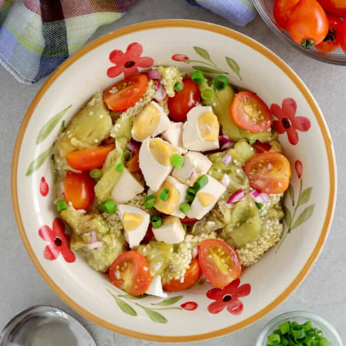 Tomato, Grilled Eggplant and Salted Egg Salad in a serving bowl