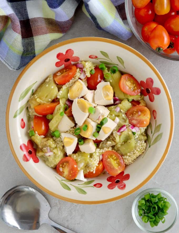 Tomato, Grilled Eggplant and Salted Egg Salad in a serving bowl