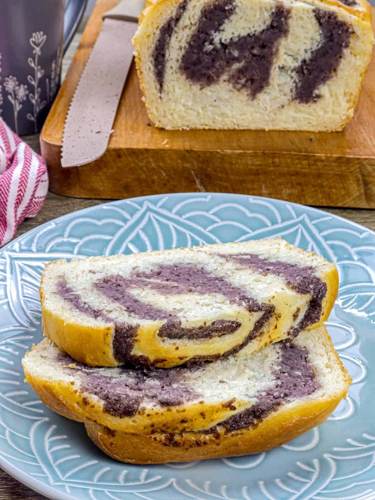 sliced monggo loaf bread on a a blue plate.