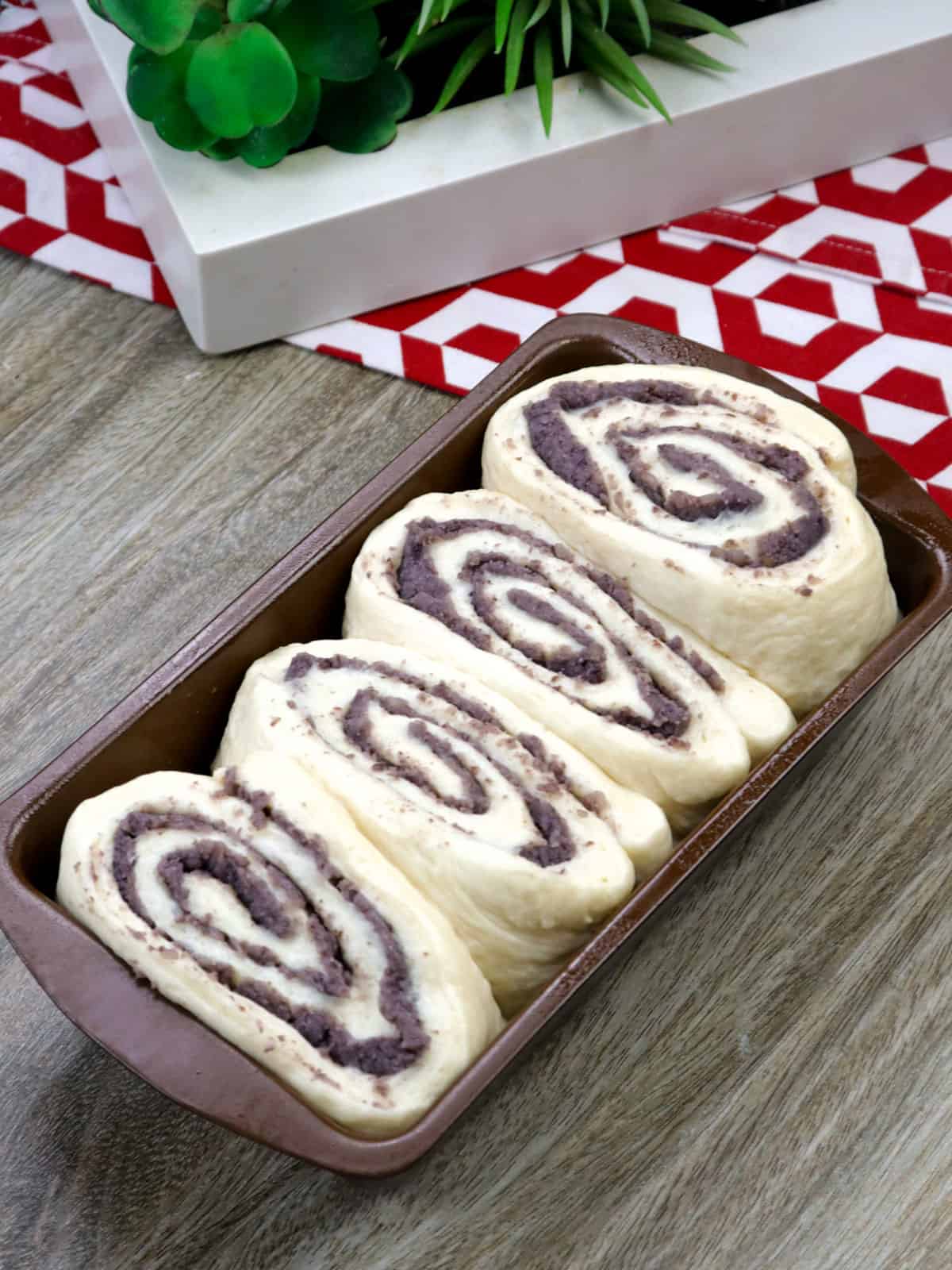 mung bean filled dough in a loaf pan.